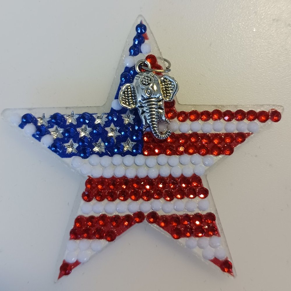 Star magnet with metal elephant charm